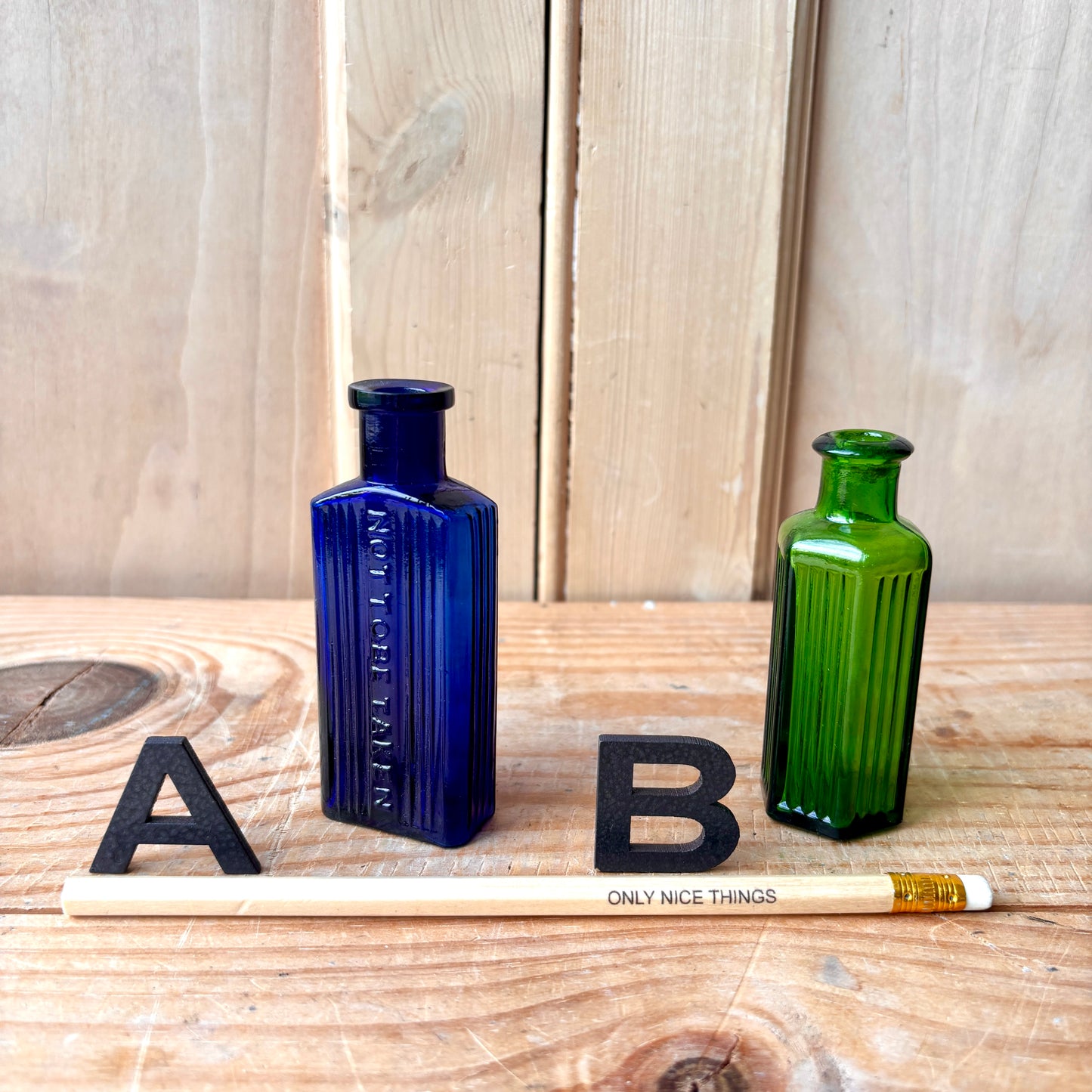 Tiny vintage chemist and poison bottles