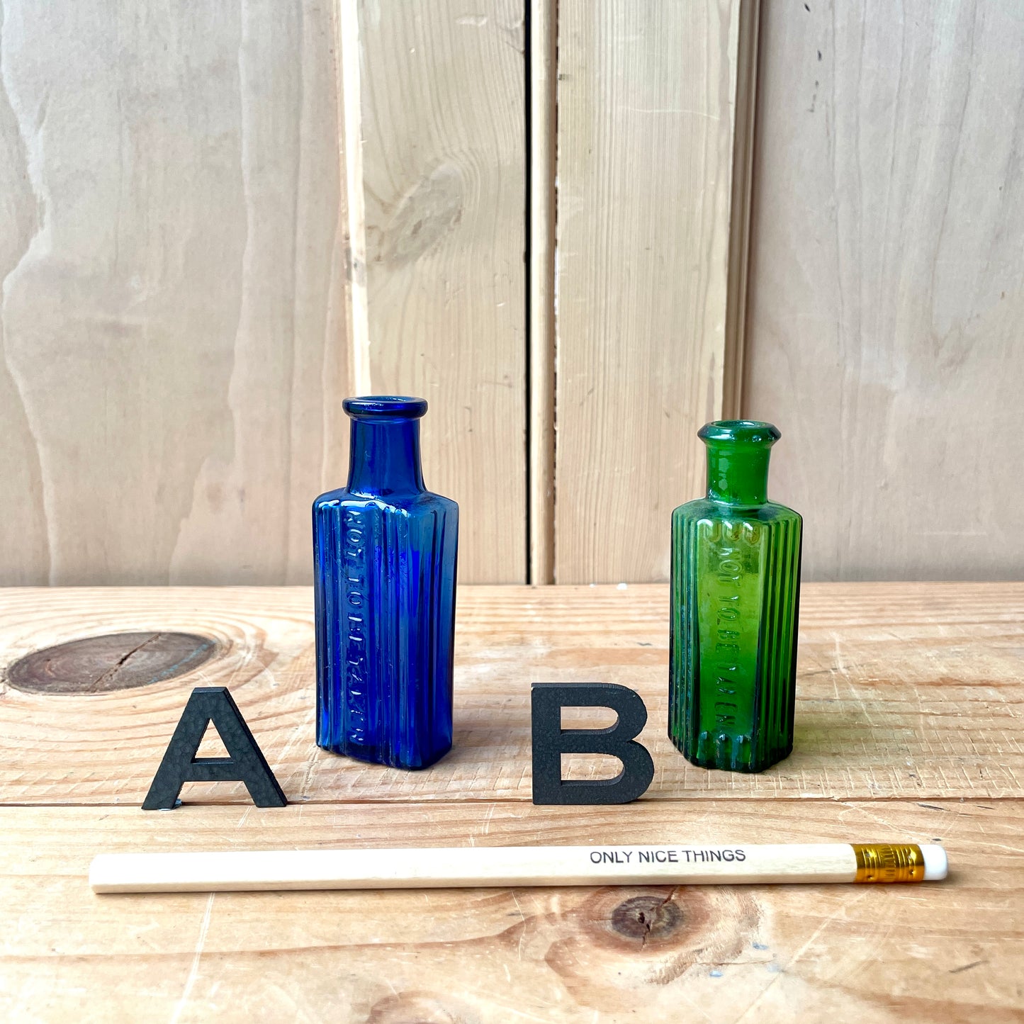 Tiny vintage chemist and poison bottles
