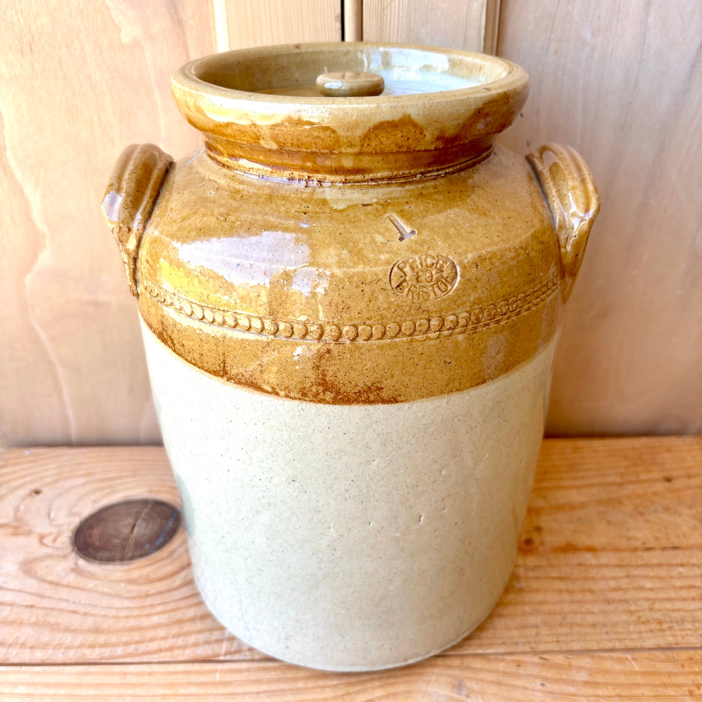 Vintage Stoneware Jar with handles and original lid.