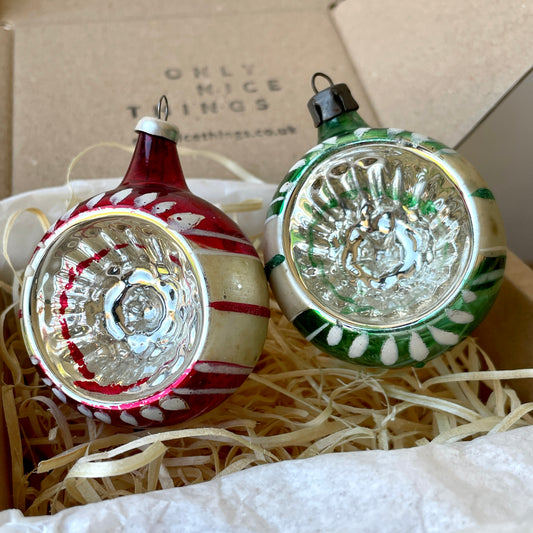 Pair of vintage concaved glass baubles