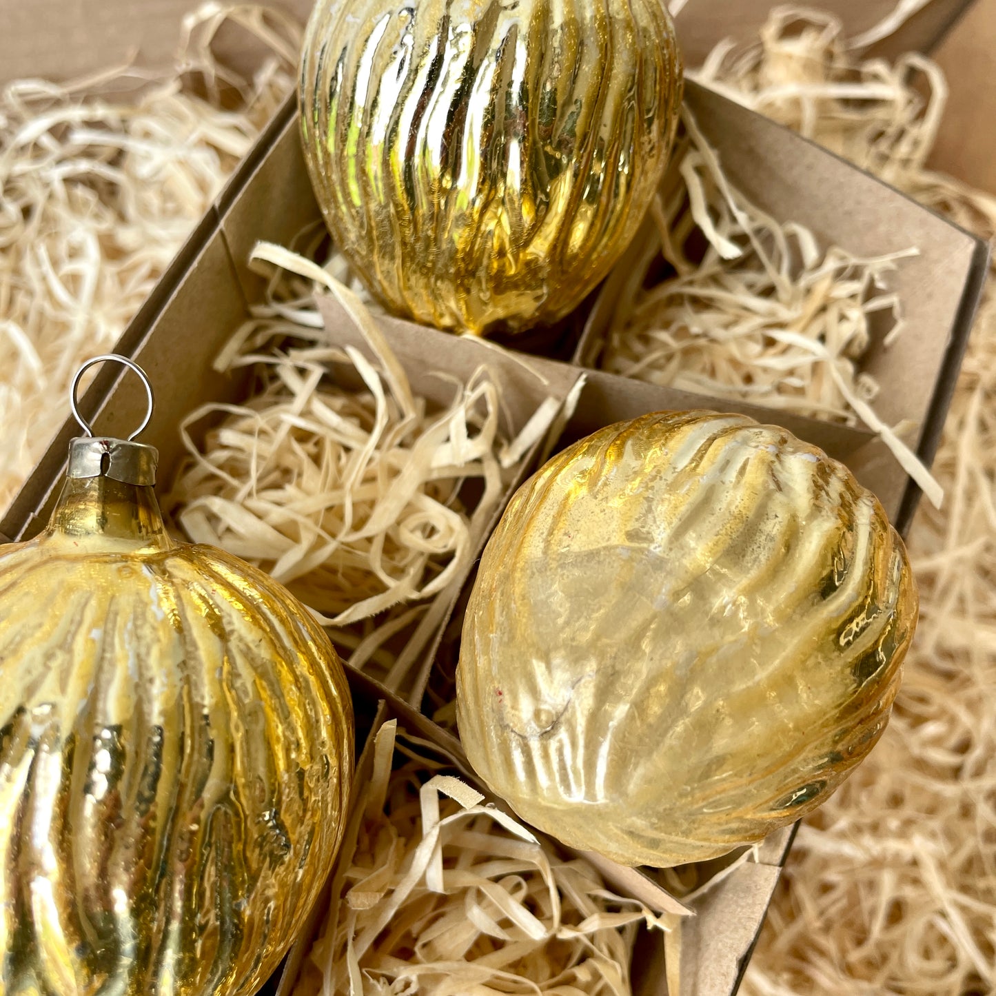 Three vintage large nut shaped glass baubles