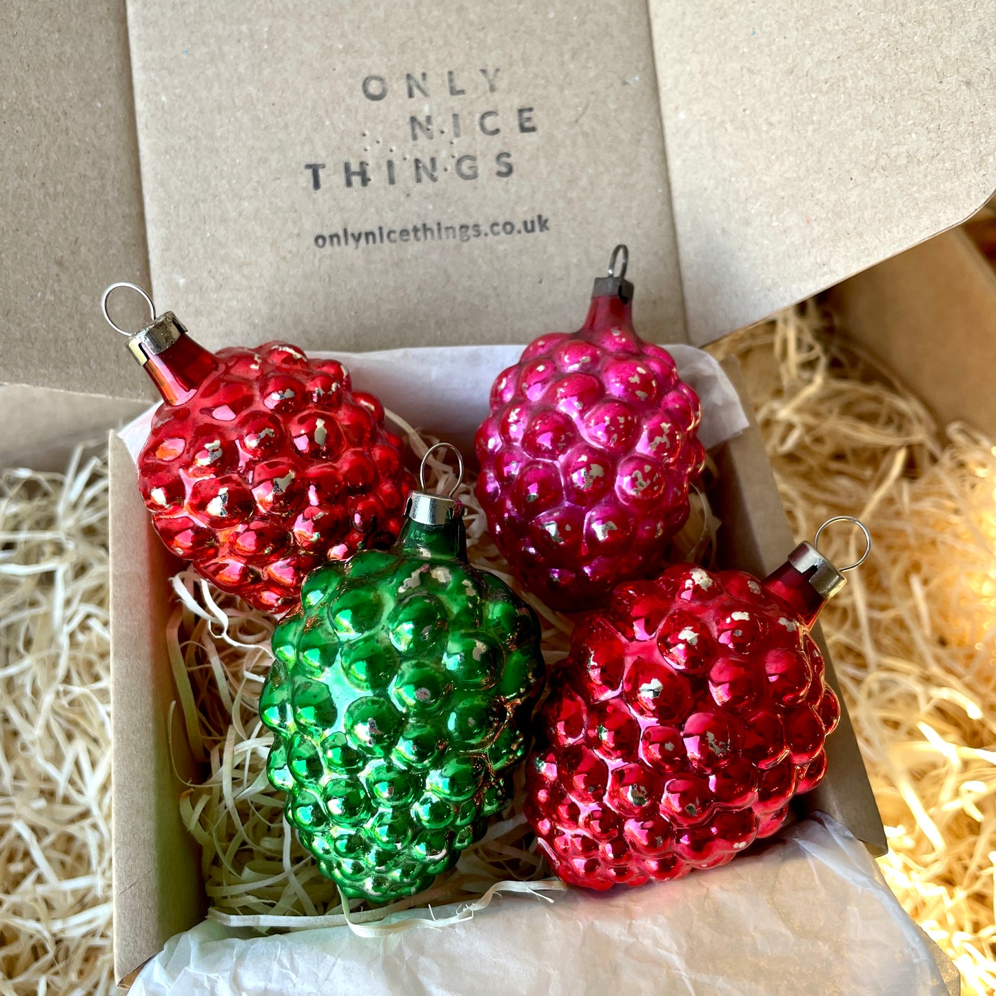 Four early berry shaped baubles