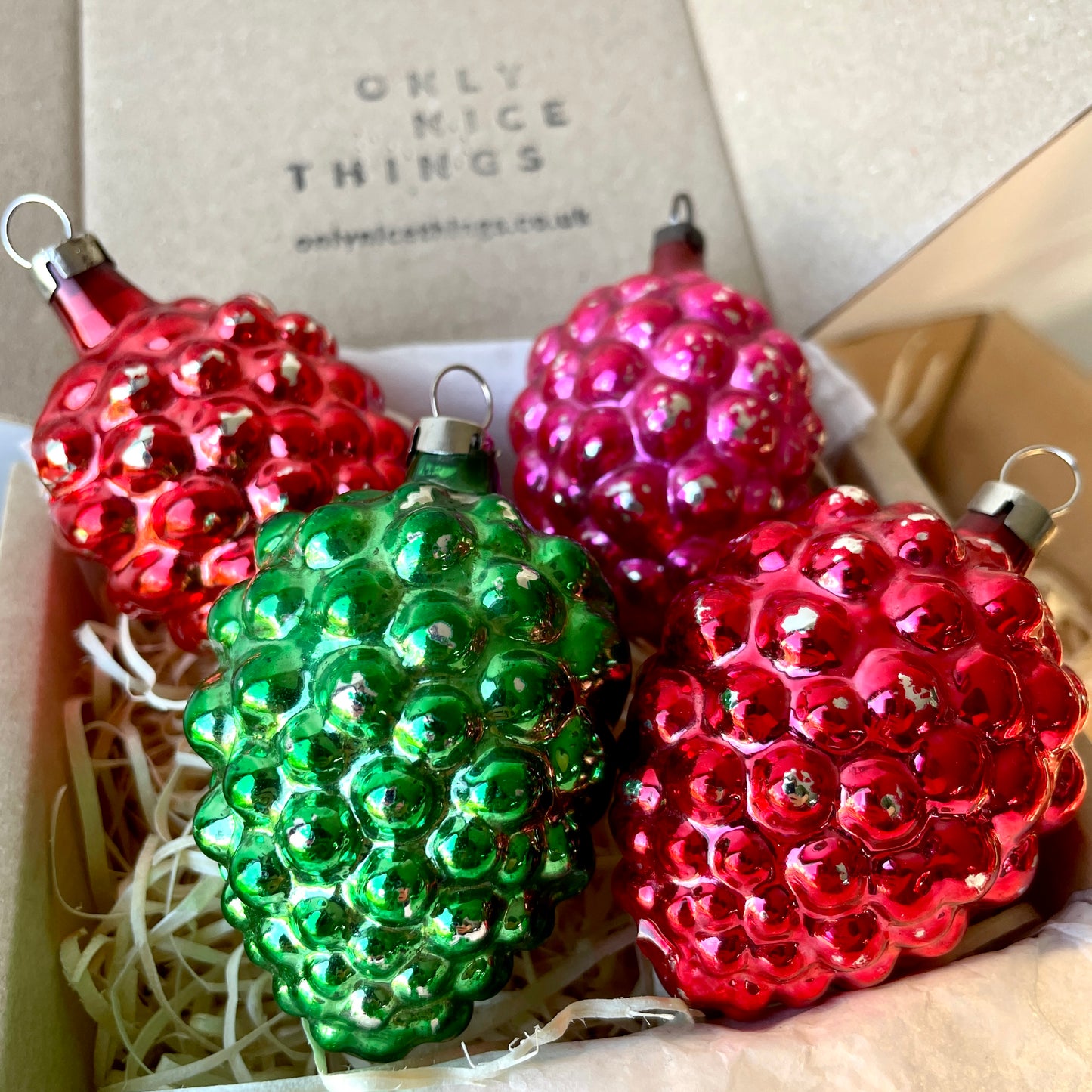 Four early berry shaped baubles