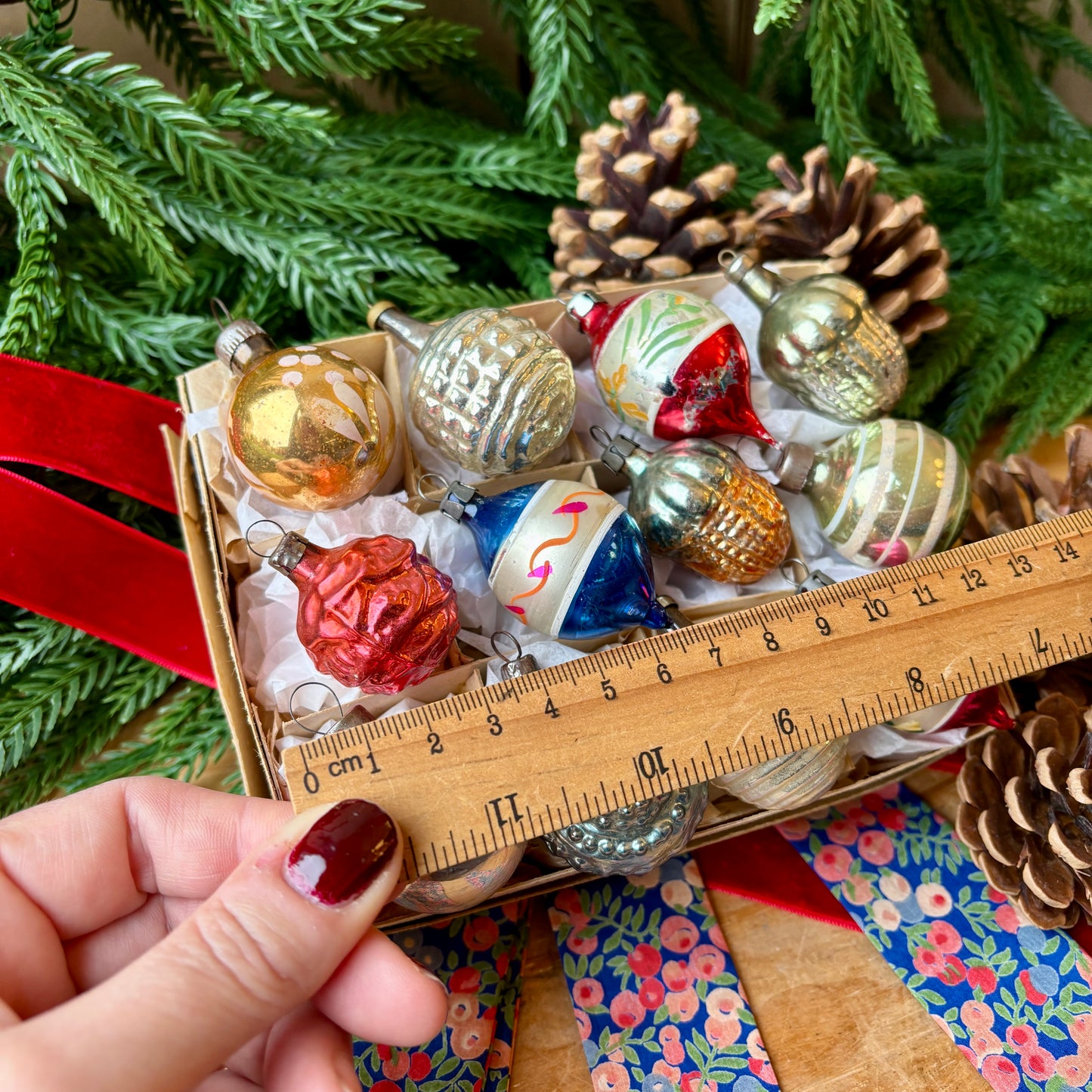 Twelve small mixed baubles