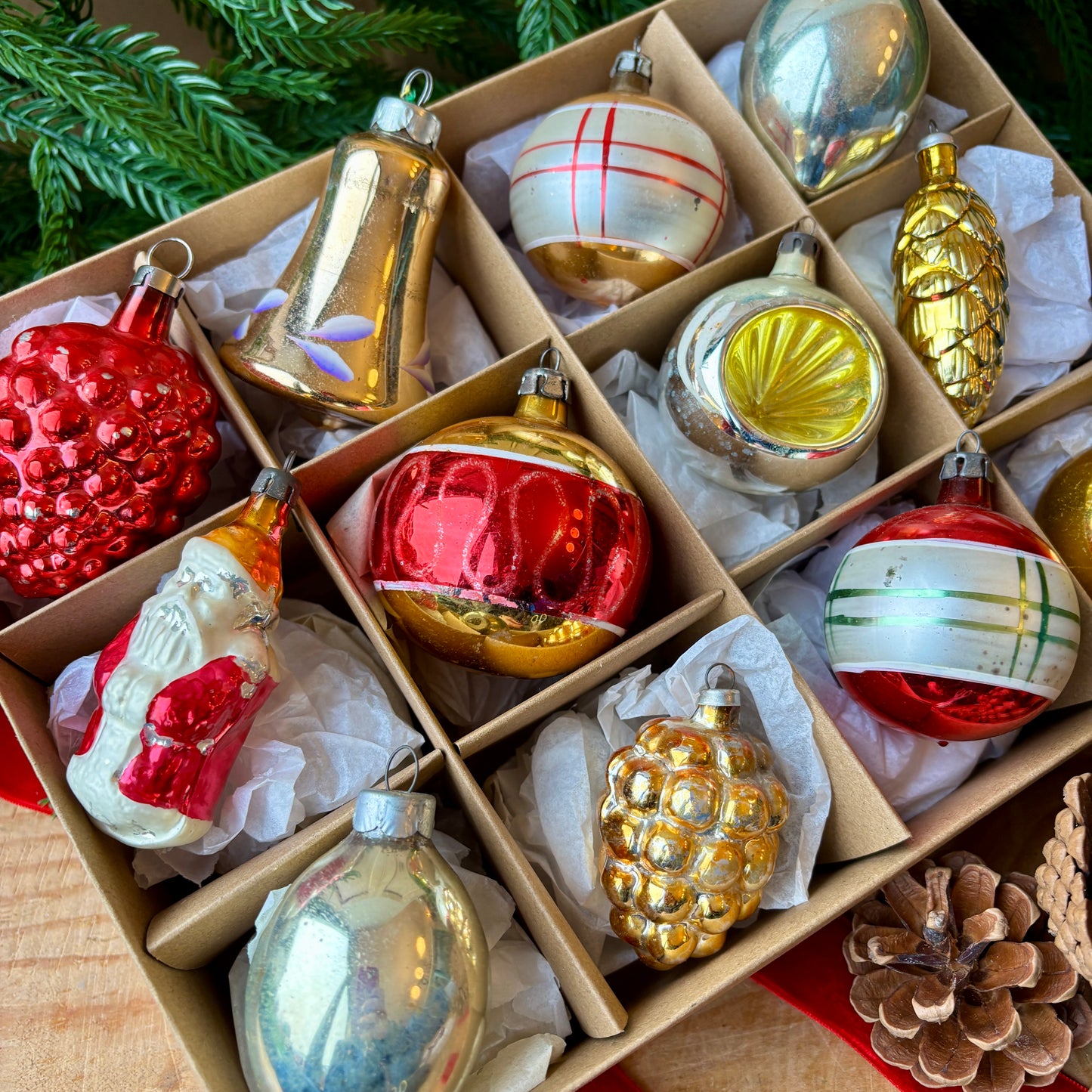 Twelve red gold and silver vintage baubles