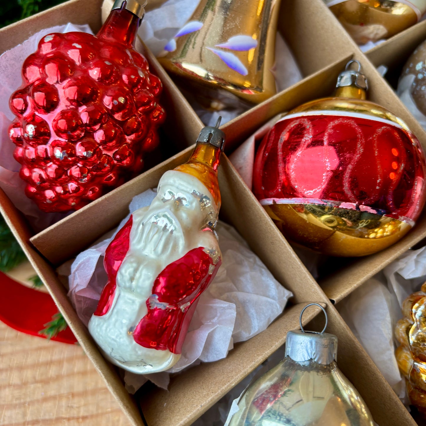 Twelve red gold and silver vintage baubles