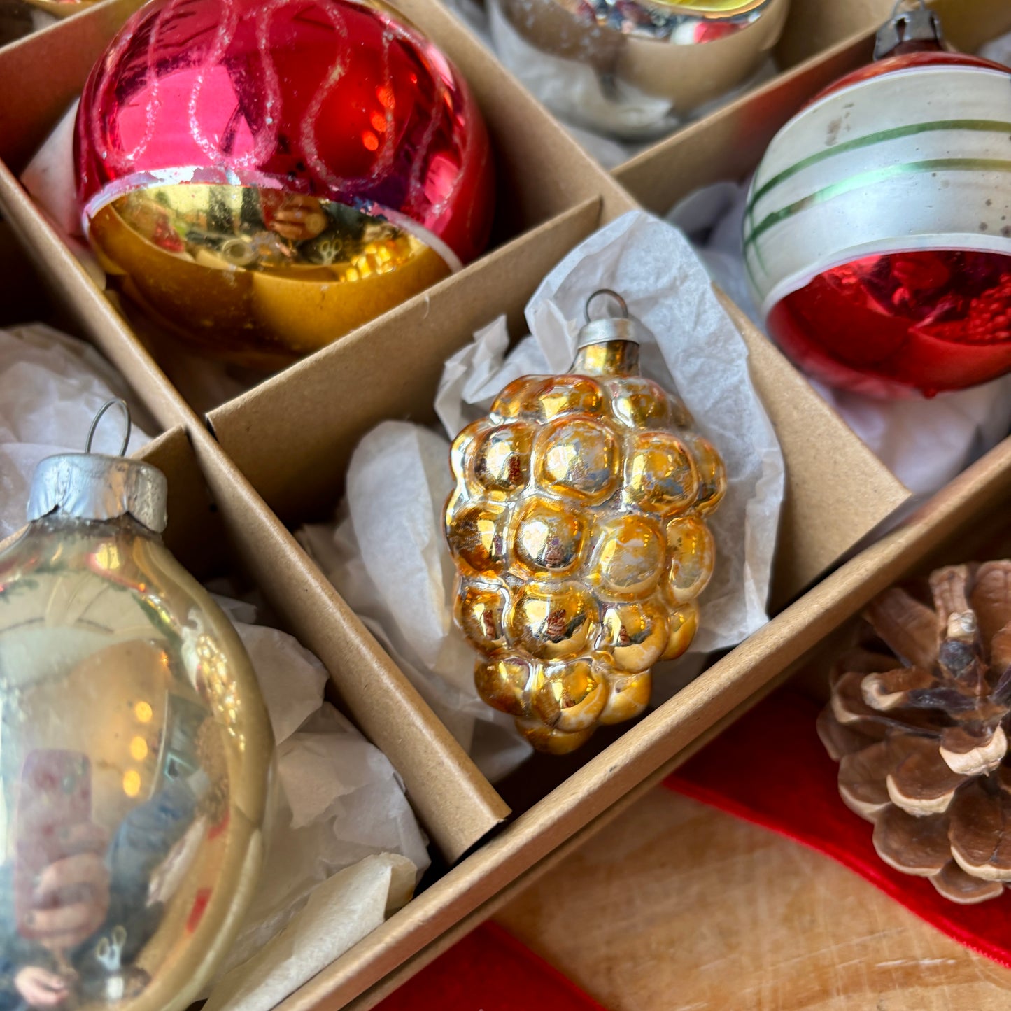 Twelve red gold and silver vintage baubles