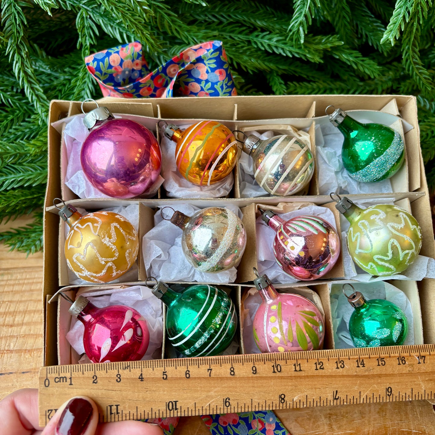 Twelve small mixed baubles