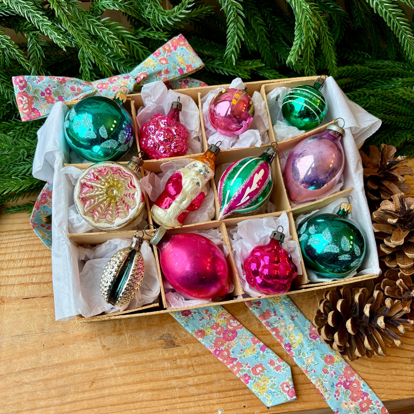Twelve pink and green vintage glass baubles