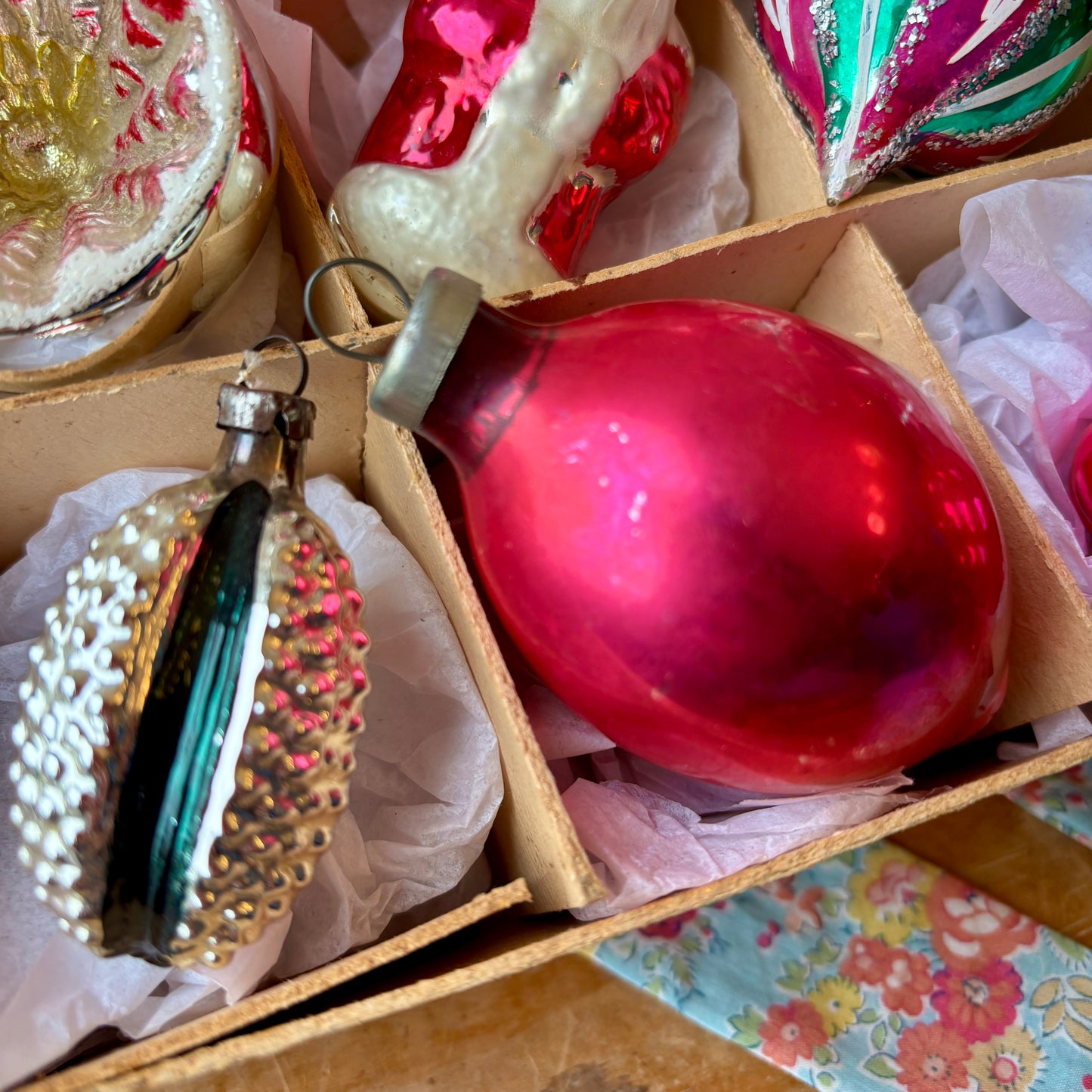 Twelve pink and green vintage glass baubles