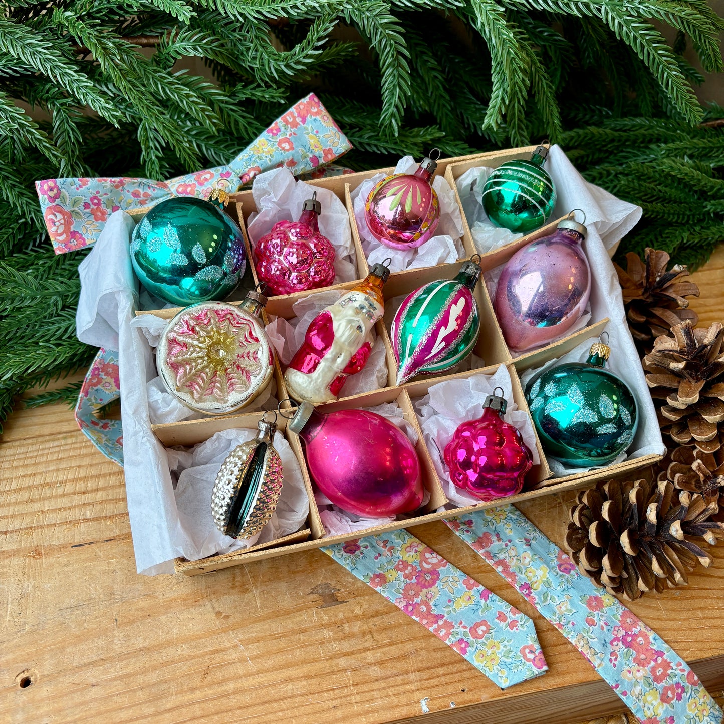 Twelve pink and green vintage glass baubles