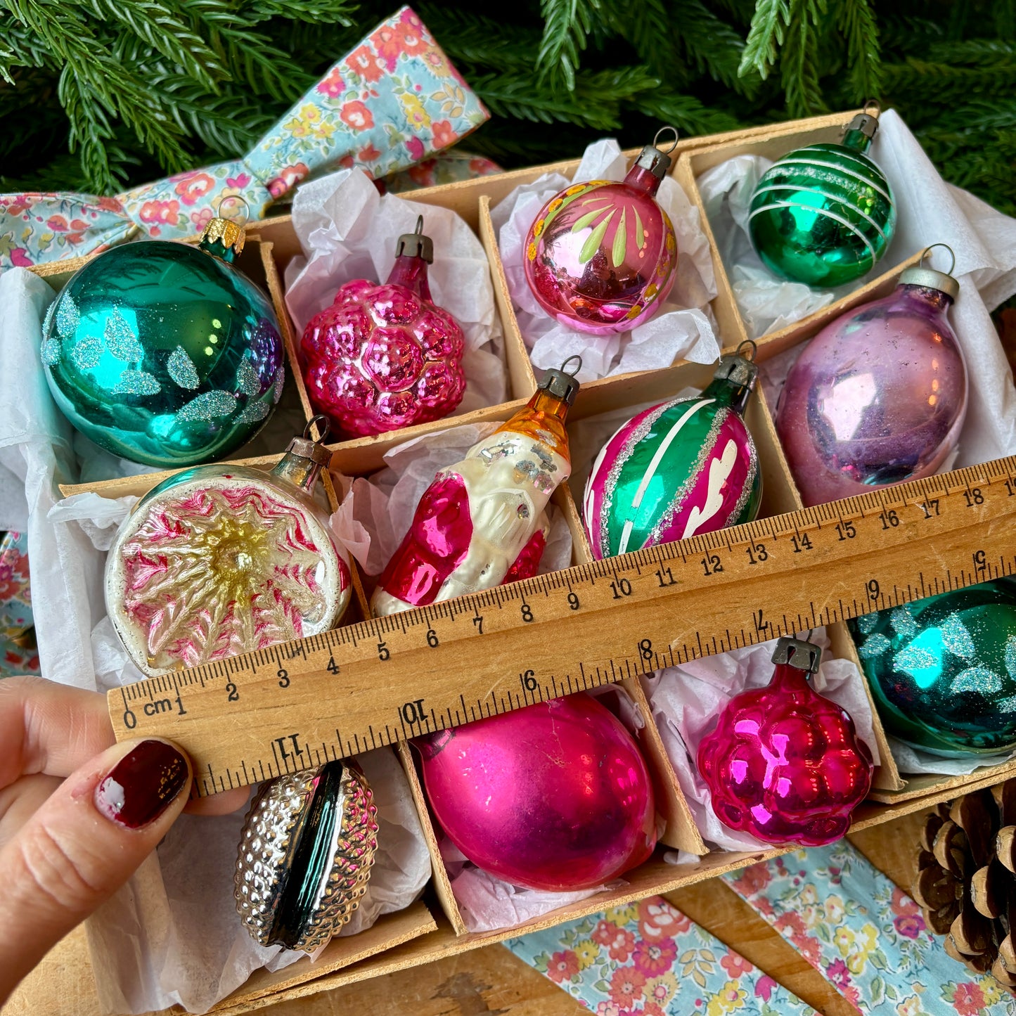 Twelve pink and green vintage glass baubles