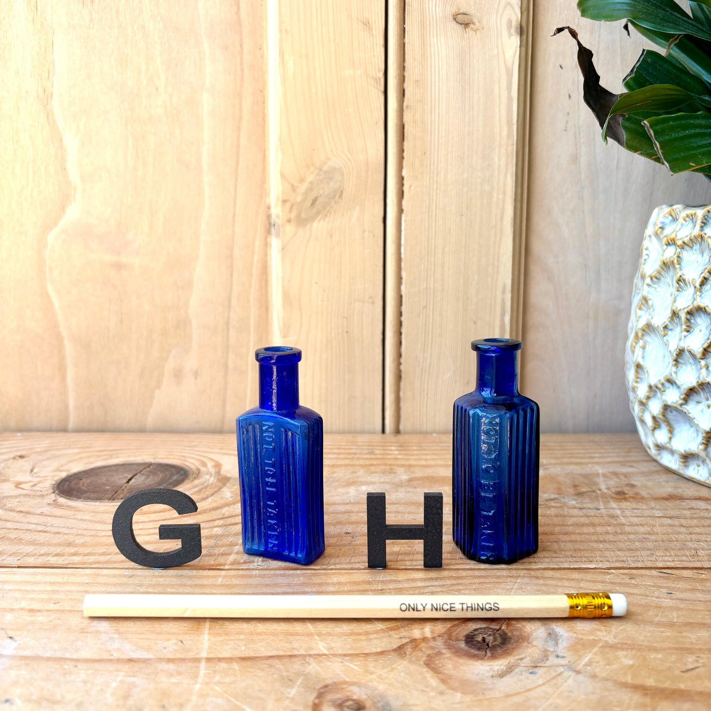 Tiny vintage chemist and poison bottles