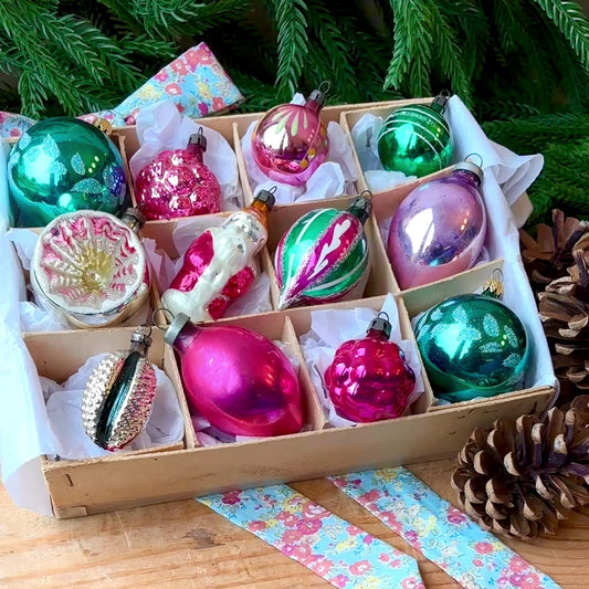 Twelve pink and green vintage glass baubles